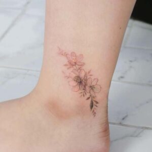 Delicate Light Pink Flower Tattoo