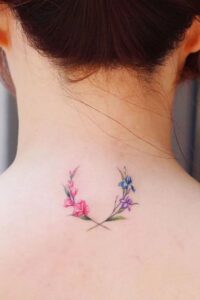 back neck small colorful gladiolus tattoo