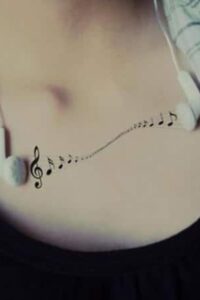 music note tattoo on chest