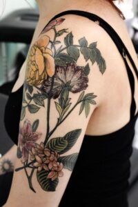 Full Upper Arm Colorful Carnation Tattoo